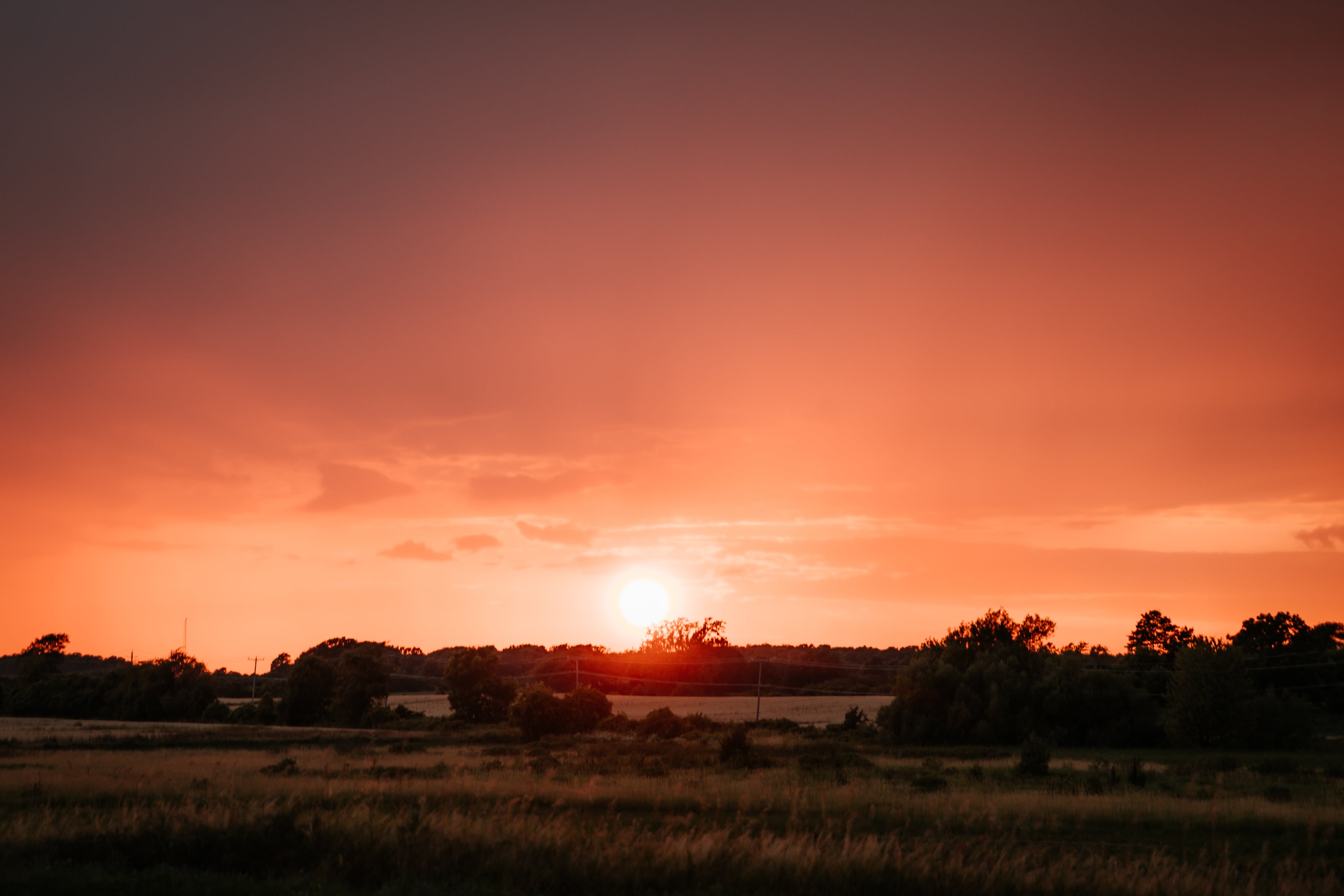 intense-red-sunset-over-fields.jpg
